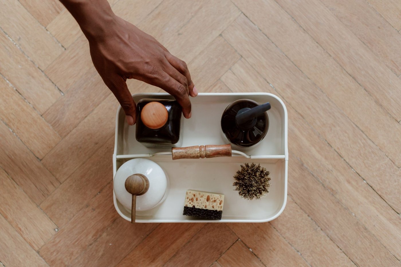 Natural cleaning supplies arranged on a tray